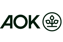 Logo der AOK mit den Buchstaben AOK und einem stilisierten Pflanzenmotiv in einem Kreis